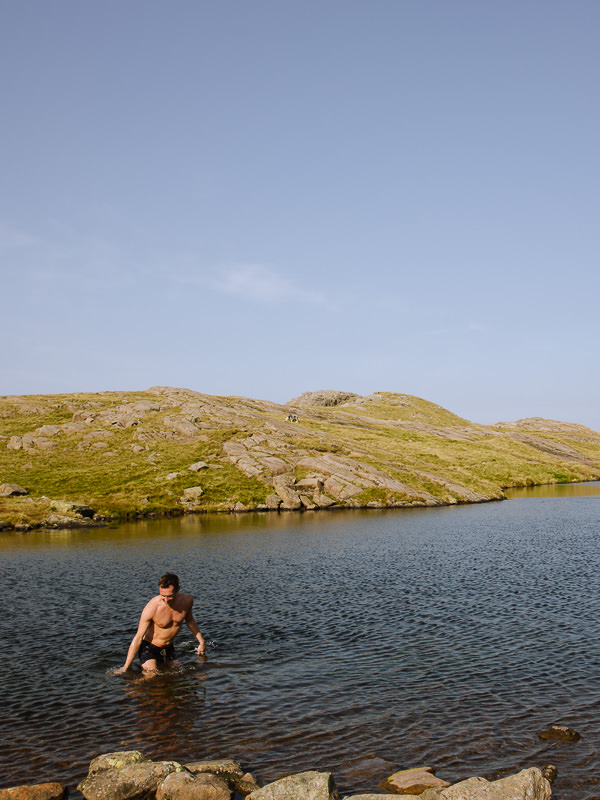 swimming in a tarn on the scafell pike walk, Lake District