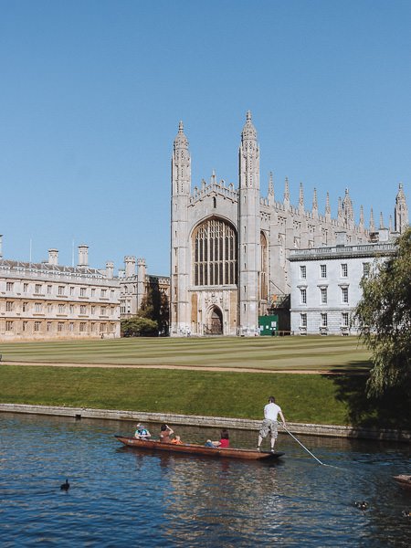 Punters sail along the river in front of King's College chapel on the Cam walk