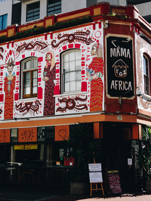 Restaurant facade with "MAMA AFRICA" above the door